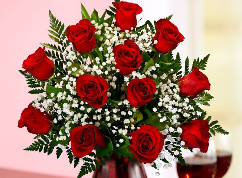 Red Roses in a Vase with Baby's Breath and Greens